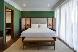 Letto o letti in una camera di BODBE Hotel