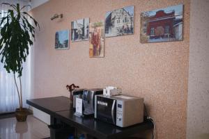 a microwave sitting on a table in a room at Hotel LUDMIR in Volodymyr-Volynskyi