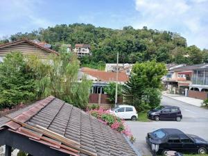 a view of a town with cars parked on a street at Preece's Homestay in Kuala Lumpur