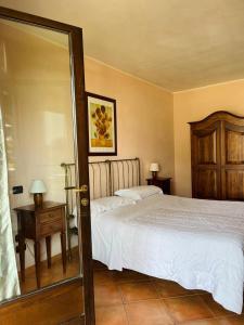 Postel nebo postele na pokoji v ubytování Albergo Cosmera