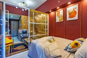 a bedroom with a bed and a bathroom with a shower at Primeworld District Condo - Near Mactan Airport in Lapu Lapu City +77 photos