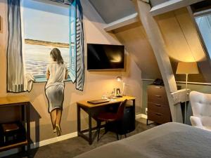 TV a/nebo společenská místnost v ubytování Hotel De Gravin