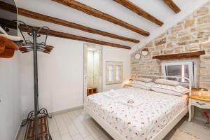 Posteľ alebo postele v izbe v ubytovaní Apartman tutto bene