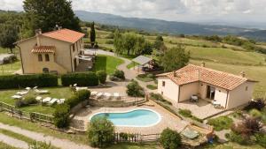 an aerial view of a house with a swimming pool at Le Casaline by VacaVilla in Tepolini