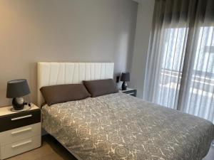 Postel nebo postele na pokoji v ubytování Oasis Beach El Raso Guardamar
