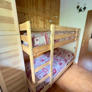 a couple of bunk beds in a room at Panorama1200A, in the Heart of the San Fermo Hills in Adrara San Rocco