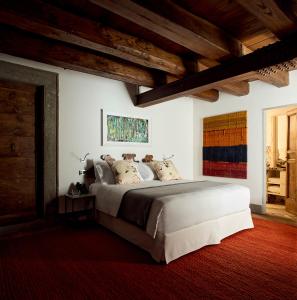 A bed or beds in a room at Palazzo Delle Pietre - Luxury Apartments