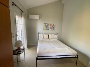 Postel nebo postele na pokoji v ubytování Olive stone Villa