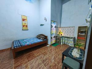 A bed or beds in a room at IjenBromo Hub Omyah Isun Hub
