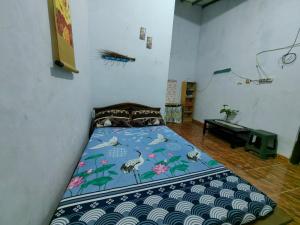 A bed or beds in a room at IjenBromo Hub Omyah Isun Hub