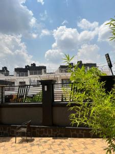 a chair sitting on top of a building at CosyNook B in Kigali