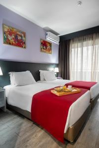 Postel nebo postele na pokoji v ubytování Hotel Estacão - Braga