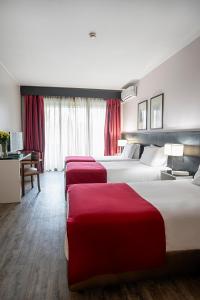 Postel nebo postele na pokoji v ubytování Hotel Estacão - Braga