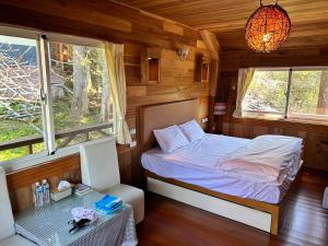 Postel nebo postele na pokoji v ubytování Lala Mountain San hao Manor