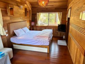 Postel nebo postele na pokoji v ubytování Lala Mountain San hao Manor