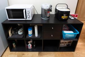 Dapur atau dapur kecil di アンドシェア 名古屋栄エリアの4LDK100平米 最大12名まで一軒家貸切 無料駐車場付 and SHARE