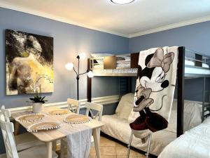 a room with a dining table and a bunk bed at Beautiful traditional home*Modern updates*Guest suite B in Katy