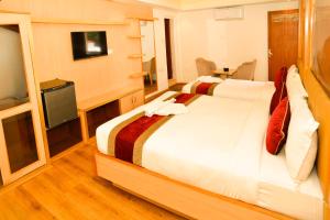 Voodi või voodid majutusasutuse Hotel Elegant Kathmandu Inn toas