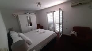 Postel nebo postele na pokoji v ubytování Apartments Lapa
