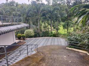 a view from the balcony of a house at Vibgyor Villa in Munnar +9 photos