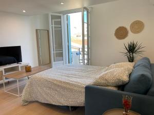 Ένα ή περισσότερα κρεβάτια σε δωμάτιο στο Appartement à 2 pas de la mer et Parking privé