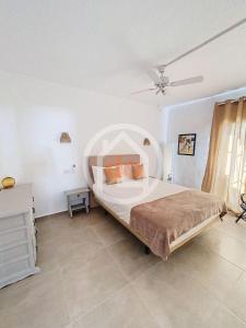 a bedroom with a large bed in a room at Apartamento Berdica in Benitachell +28 photos
