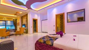 a woman laying on a bed in a room at villa vinka in Kalkan +80 photos