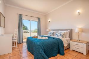 a bedroom with a bed and a large window at Host Wise - Bright & Stylish Lagos Flat with Pool in Lagos +17 photos