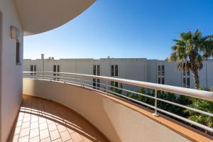 a balcony with a view of a building at Host Wise - Bright & Stylish Lagos Flat with Pool in Lagos