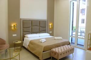 Postel nebo postele na pokoji v ubytování InCentro Elegant Rooms