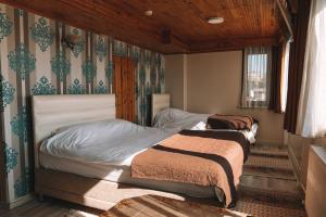 Katil atau katil-katil dalam bilik di Green Life Apart Hotel