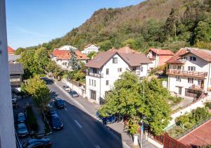 a view of a street in a town with houses at GreenTeam Apartments in Râmnicu Vâlcea