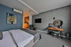 TV a/nebo společenská místnost v ubytování Hotel Botanica