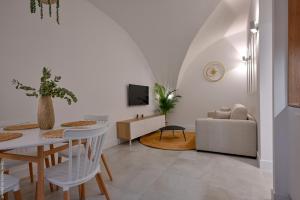 a living room with a table and a couch at Ancienne cave de pêcheur in La Ciotat