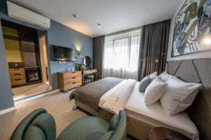Postel nebo postele na pokoji v ubytování Hotel Botanica