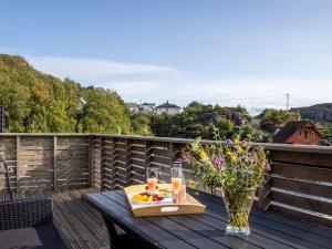 a tray of food on a table on a balcony at Holiday Home Lange by Interhome in Bømlo