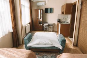 a hospital room with a bed and a kitchen at Green Life Apart Hotel in Istanbul