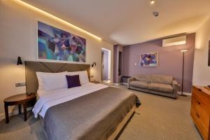 Postel nebo postele na pokoji v ubytování Hotel Botanica
