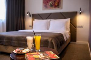 Postel nebo postele na pokoji v ubytování Hotel Botanica