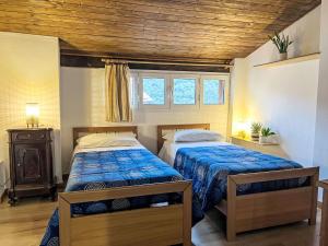 Ένα ή περισσότερα κρεβάτια σε δωμάτιο στο Apartment Asplanato - DOL166 by Interhome