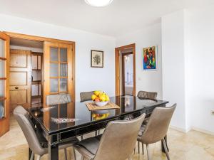 a dining room with a table and chairs at Apartment Blanes Beach by Interhome in Blanes