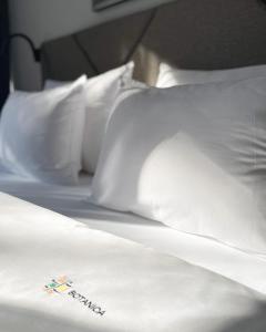 Postel nebo postele na pokoji v ubytování Hotel Botanica