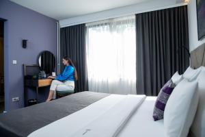 Postel nebo postele na pokoji v ubytování Hotel Botanica