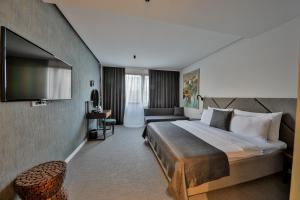 Postel nebo postele na pokoji v ubytování Hotel Botanica + 37 fotografií