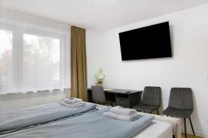 Μια τηλεόραση ή/και κέντρο ψυχαγωγίας στο Modern Apartments Neuburg 7 - New