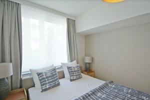 Postel nebo postele na pokoji v ubytování Zonnig appartement in Duinbergen + 29 fotografií