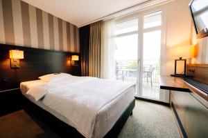 Katil atau katil-katil dalam bilik di Park Hotel Winterthur