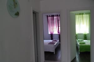 Postel nebo postele na pokoji v ubytování Apartments Jadranka