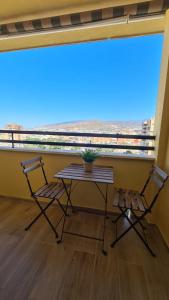a table and two chairs on a balcony with a view at CT 344 AL - Faro's Teckel Apartments Geminis Sky in Aguadulce