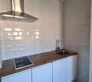 a kitchen with a sink and a counter top at CT 344 AL - Faro's Teckel Apartments Geminis Sky in Aguadulce
